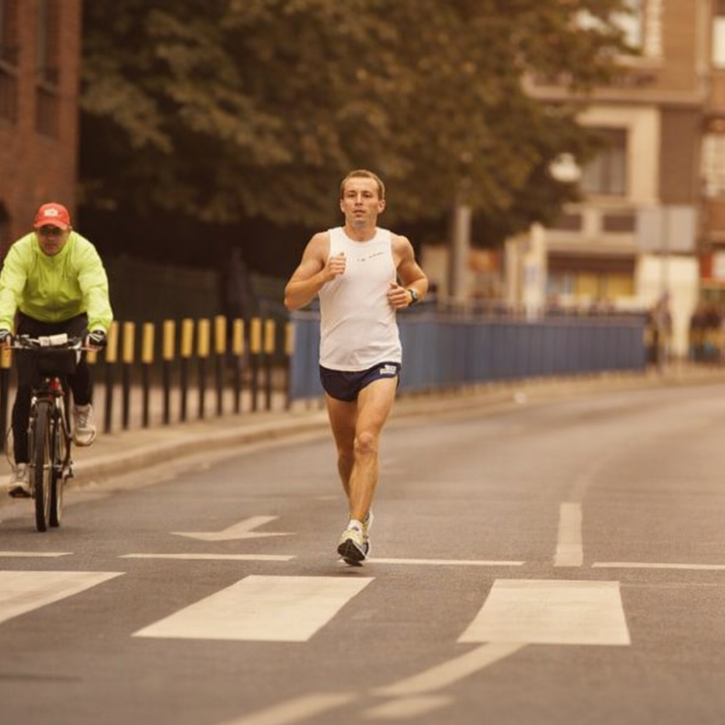 A determined runner in a white