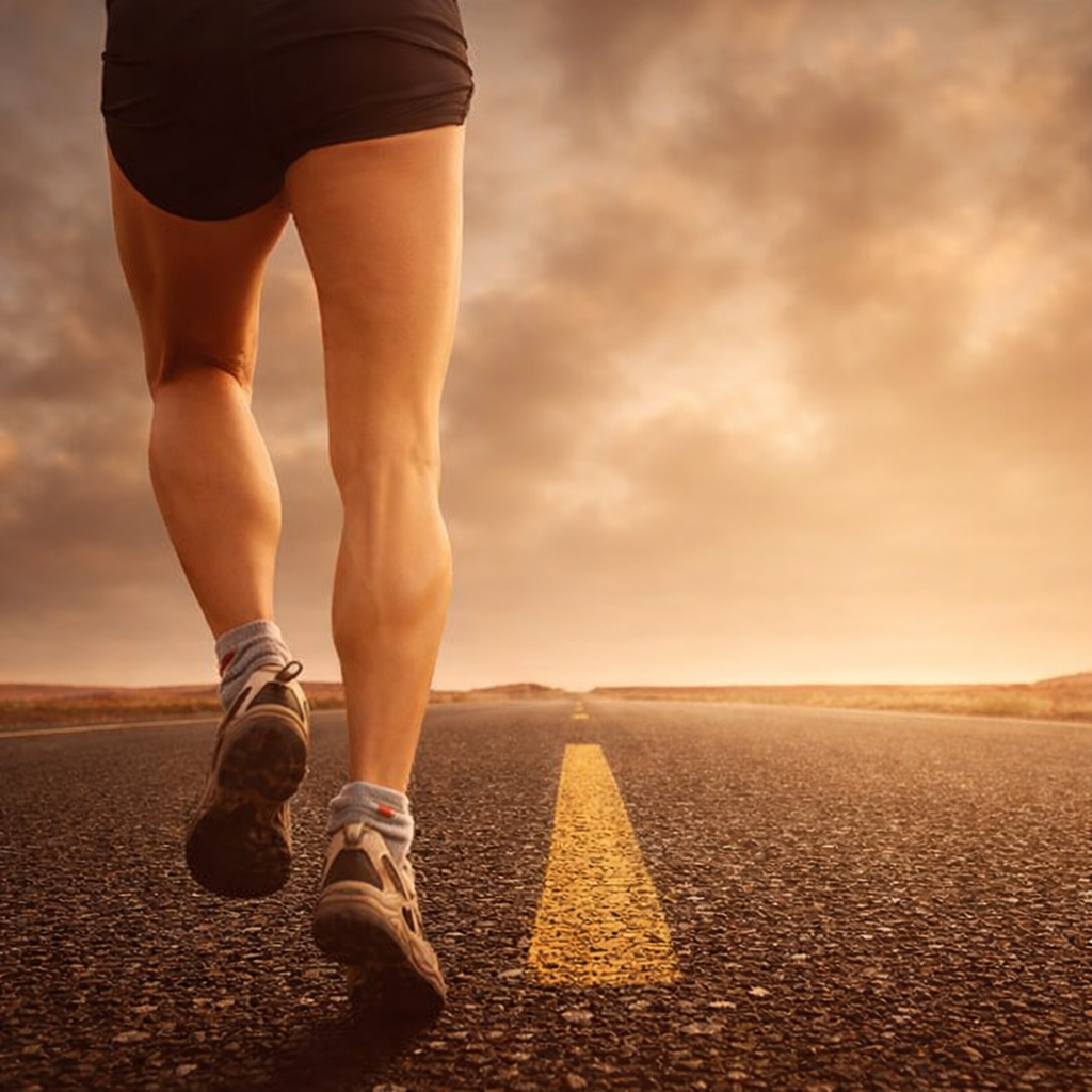 A runner strides down an empty